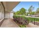 Covered porch with view of streetscape and mature trees at 502 Nile St, Aurora, CO 80010