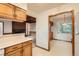 Bright kitchen view with wooden accents and an open layout connecting to the living area at 502 Nile St, Aurora, CO 80010