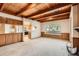 Cozy living room with a wooden ceiling, large window and carpeted floors at 502 Nile St, Aurora, CO 80010