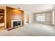Spacious living room featuring a fireplace and large window at 502 Nile St, Aurora, CO 80010