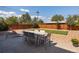 Spacious backyard featuring a patio with an outdoor dining set and room to enjoy at 5915 W 5Th Ave, Lakewood, CO 80226