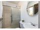 Bathroom featuring tiled shower and modern vanity at 5915 W 5Th Ave, Lakewood, CO 80226