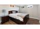 Cozy bedroom with hardwood floors, natural light, and a comfortable bed at 5915 W 5Th Ave, Lakewood, CO 80226