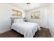 Cozy bedroom with wood floor and two windows with natural light at 5915 W 5Th Ave, Lakewood, CO 80226