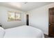 Bright bedroom featuring wood floors and natural light at 5915 W 5Th Ave, Lakewood, CO 80226