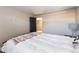 Bedroom with hardwood floors, neutral walls, and a comfortable bed at 5915 W 5Th Ave, Lakewood, CO 80226