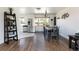 This dining area connects to the kitchen with stainless appliances and modern flooring at 5915 W 5Th Ave, Lakewood, CO 80226