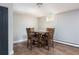 The dining area has a wooden table with four chairs, perfect for Gathering meals or entertaining guests at 5915 W 5Th Ave, Lakewood, CO 80226