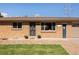Close up of charming brick home featuring a well-manicured lawn at 5915 W 5Th Ave, Lakewood, CO 80226