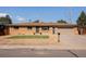 Charming brick home featuring a well-manicured lawn and a two-car garage at 5915 W 5Th Ave, Lakewood, CO 80226