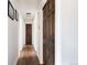 Hallway featuring wood floors and paneled doors at 5915 W 5Th Ave, Lakewood, CO 80226