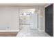 Conveniently designed kitchenette with white cabinets, modern appliances, and tile flooring at 5915 W 5Th Ave, Lakewood, CO 80226