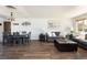 Open concept living room and dining room with hardwood floors at 5915 W 5Th Ave, Lakewood, CO 80226