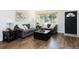 Cozy living room with hardwood floors, a gray sofa, and natural light at 5915 W 5Th Ave, Lakewood, CO 80226