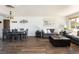 Inviting living room features wood floors, a dining table, and a comfortable sofa for relaxing at 5915 W 5Th Ave, Lakewood, CO 80226