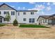 Exterior backyard view of a newly constructed home with a lawn and gravel landscaping at 6646 N Nepal St, Aurora, CO 80019