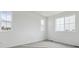Bright, naturally lit bedroom featuring a large window and neutral carpet at 6646 N Nepal St, Aurora, CO 80019