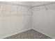 Walk-in closet featuring wire shelving and neutral carpeting at 6646 N Nepal St, Aurora, CO 80019