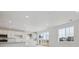Bright kitchen featuring sleek white cabinets, stainless steel appliances, and a scenic view at 6646 N Nepal St, Aurora, CO 80019