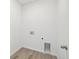 Bright laundry room featuring vinyl floors and washer/dryer hookups at 6646 N Nepal St, Aurora, CO 80019