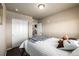Bedroom with carpet and a view through the open doorway to the rest of the house at 9258 Rockhurst St # 303, Highlands Ranch, CO 80129