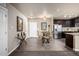 Open floor plan with dining area and modern kitchen at 9258 Rockhurst St # 303, Highlands Ranch, CO 80129