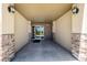 Well-lit entryway with brick accents leads into the condo building at 9258 Rockhurst St # 303, Highlands Ranch, CO 80129