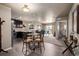 Open-concept kitchen with stainless steel appliances, a dining area, and access to living room at 9258 Rockhurst St # 303, Highlands Ranch, CO 80129