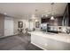 Open-concept kitchen with stainless steel appliances and adjacent dining area at 9258 Rockhurst St # 303, Highlands Ranch, CO 80129