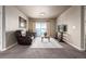 Cozy living room featuring a sliding glass door to a balcony at 9258 Rockhurst St # 303, Highlands Ranch, CO 80129