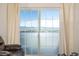 Bright living room featuring sliding glass doors with beautiful mountain views at 9258 Rockhurst St # 303, Highlands Ranch, CO 80129