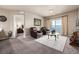 Comfortable living room with a glimpse into the primary bedroom at 9258 Rockhurst St # 303, Highlands Ranch, CO 80129