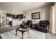 Open-concept living area connected to the kitchen and dining room at 9258 Rockhurst St # 303, Highlands Ranch, CO 80129