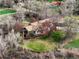 Expansive single-story home on a large, beautifully landscaped lot with mature trees and a private setting at 11489 W Bear Creek Dr, Lakewood, CO 80227