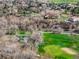 Scenic aerial view of golf course and houses at 11489 W Bear Creek Dr, Lakewood, CO 80227