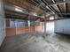 Clean barn interior with stalls, wood paneling, and ample space at 11489 W Bear Creek Dr, Lakewood, CO 80227