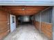 Inside of barn showcasing wood stalls and interior door at 11489 W Bear Creek Dr, Lakewood, CO 80227
