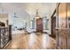 Elegant foyer showcasing a wooden door, hardwood floors, and an ornate chandelier, creating a grand entrance at 11489 W Bear Creek Dr, Lakewood, CO 80227