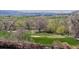 Picturesque golf course view with a bridge and sand trap at 11489 W Bear Creek Dr, Lakewood, CO 80227