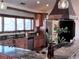 Kitchen with granite countertops, wood cabinets, and stainless steel appliances at 11489 W Bear Creek Dr, Lakewood, CO 80227