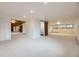 A partially finished basement has ample living space and a sliding barn door at 11489 W Bear Creek Dr, Lakewood, CO 80227