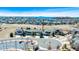 Expansive aerial view of a suburban neighborhood with mountain views and well-maintained landscaping at 7447 Soapstone Way, Castle Rock, CO 80108