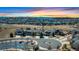Aerial view of the community featuring several homes and landscaped green spaces and mountain views at 7447 Soapstone Way, Castle Rock, CO 80108