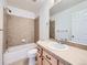 Bathroom with tub and shower, a vanity sink and storage cabinet at 7447 Soapstone Way, Castle Rock, CO 80108
