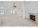 Large bedroom with fireplace, ceiling fan, and ample natural light from multiple windows at 7447 Soapstone Way, Castle Rock, CO 80108
