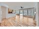Open floor plan featuring hardwood floors, large windows, and a seamless transition to the kitchen at 7447 Soapstone Way, Castle Rock, CO 80108