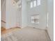 Bright living room with high ceilings, large windows, and neutral carpet and paint at 7447 Soapstone Way, Castle Rock, CO 80108