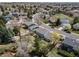 An aerial view showcasing the neighborhood, mature trees and landscaping at 18263 E Berry Dr, Centennial, CO 80015