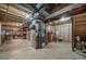 Unfinished basement with exposed beams and utilities, offering potential for customization and storage at 18263 E Berry Dr, Centennial, CO 80015