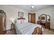Bedroom features classic furnishings, soft bedding, and warm lighting at 18263 E Berry Dr, Centennial, CO 80015
